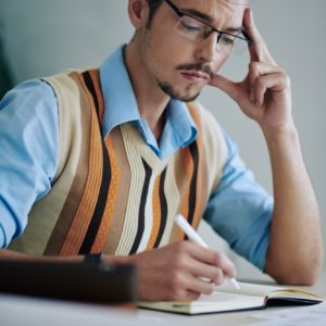 Man writing in journal